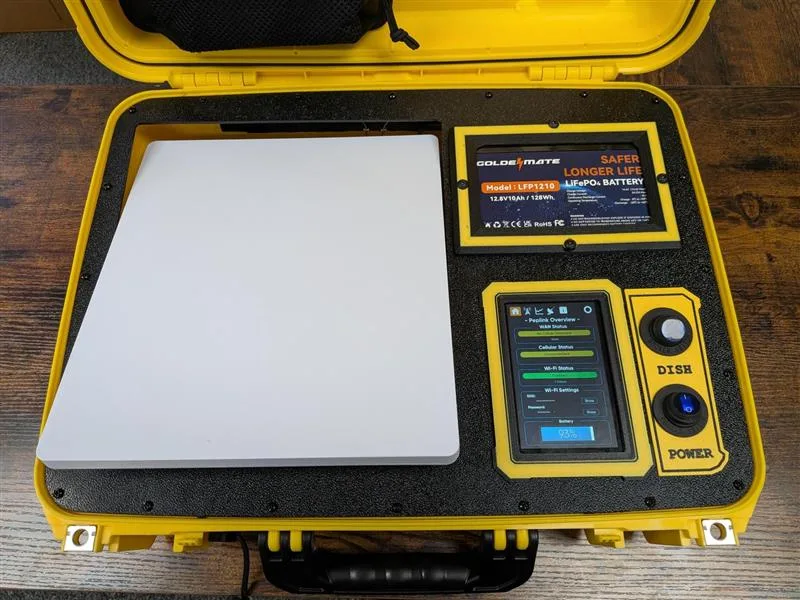 APEX kit open with Starlink dish, battery and Peplink touchscreen